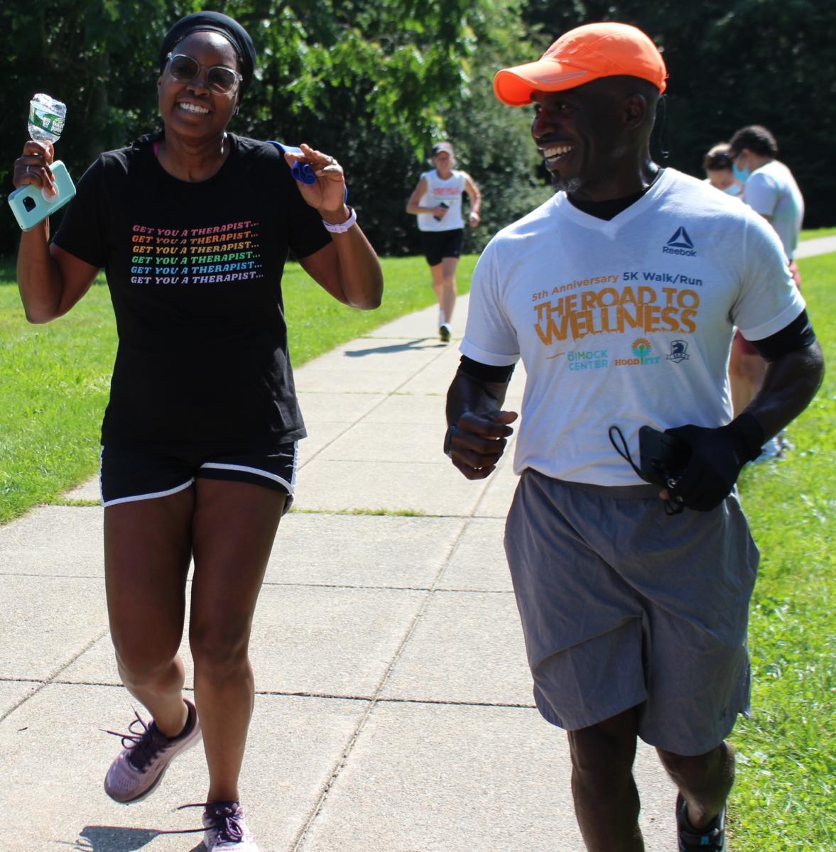 Committee member Dr. Charmaine Jackman and Coach Yvel finish a run in Franklin Park